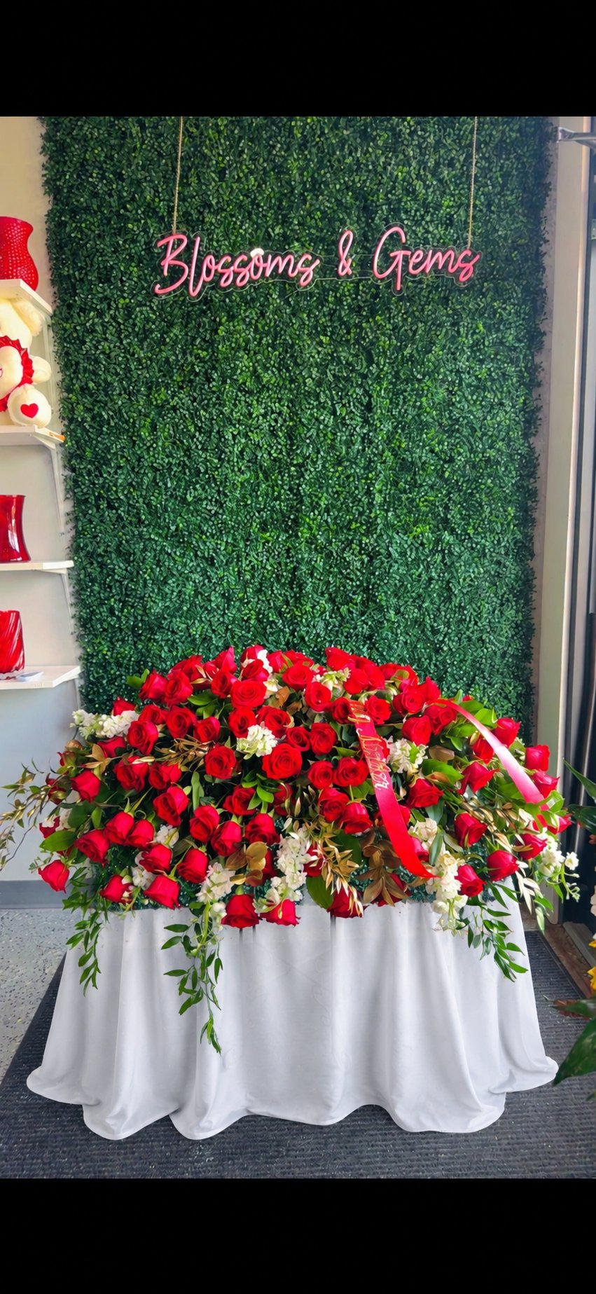 Full red rose casket spray designed by Blossoms & Gems