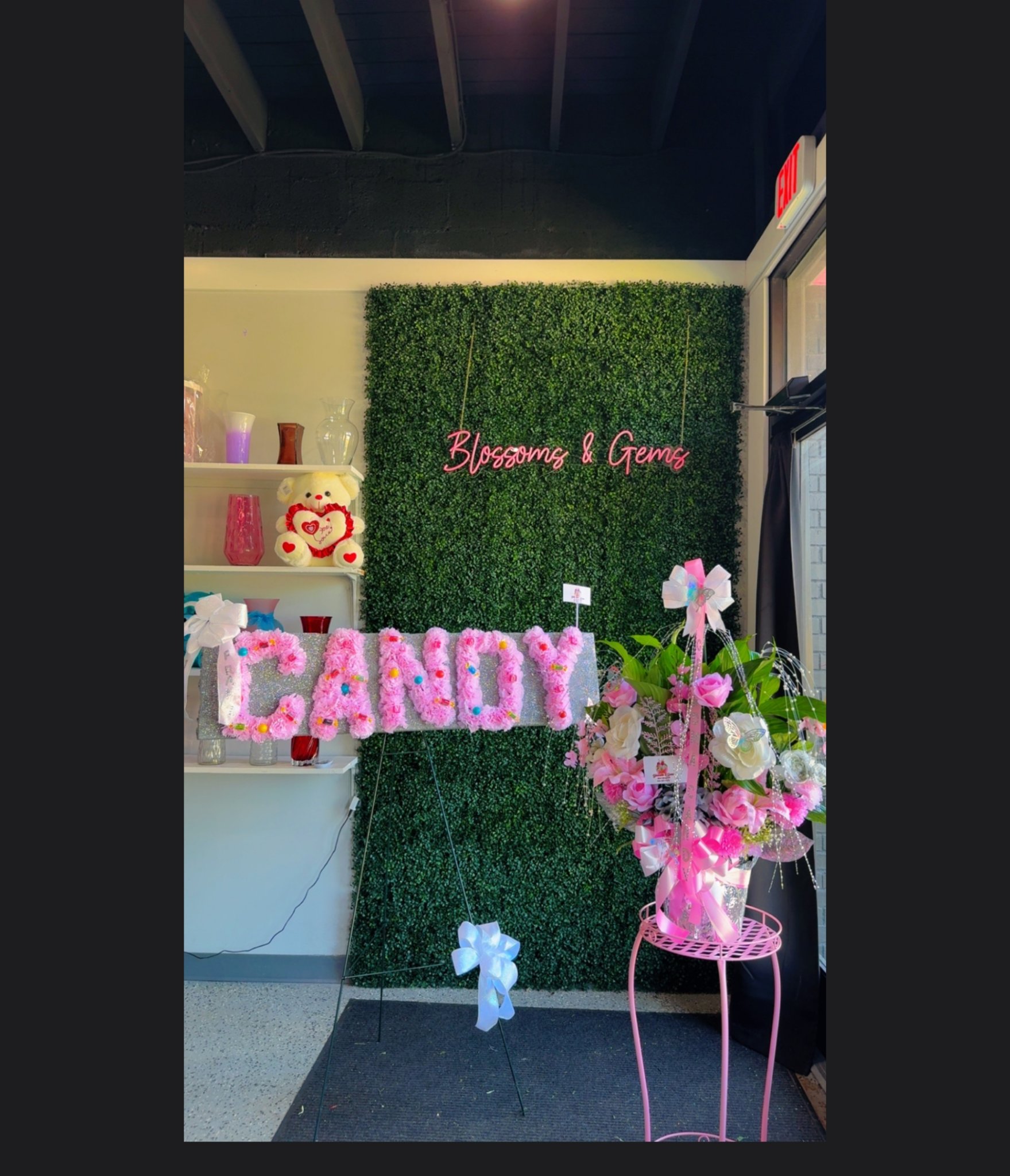 Name plate arrangement spelling CANDY in pink flowers, from Blossoms & Gems