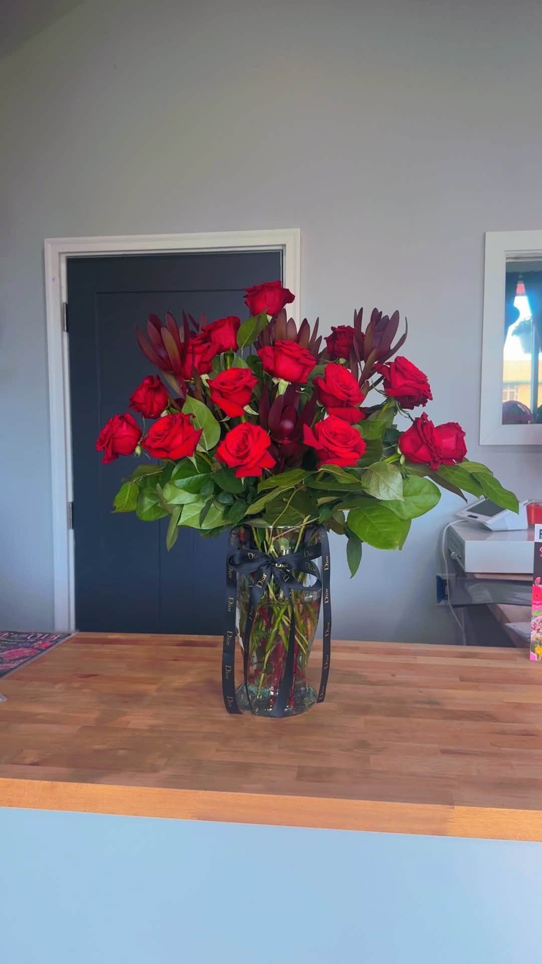 Red rose vase arrangement by Blossoms & Gems
